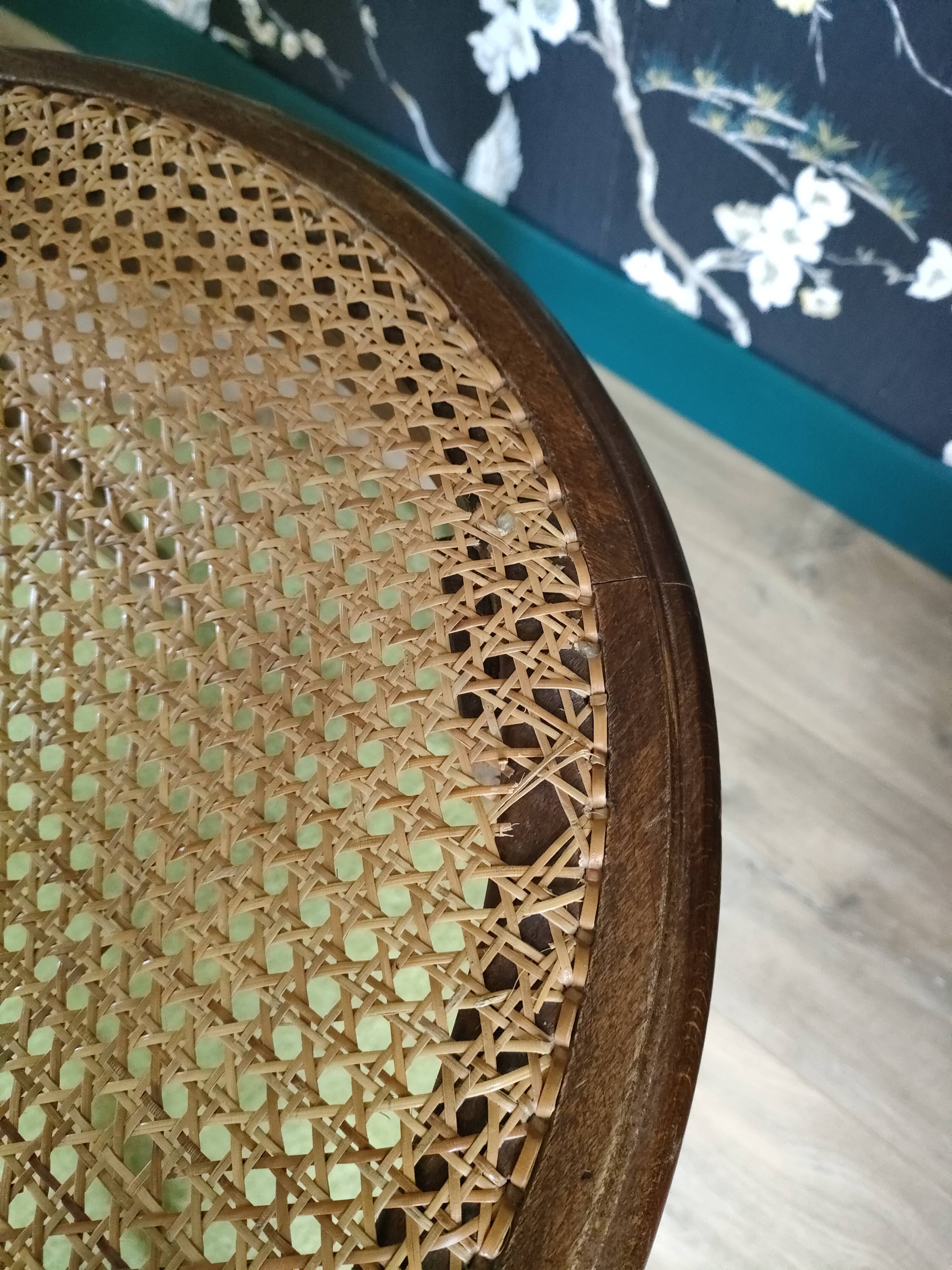 Wooden chair sitting in cannage