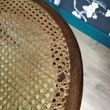 Wooden chair sitting in cannage