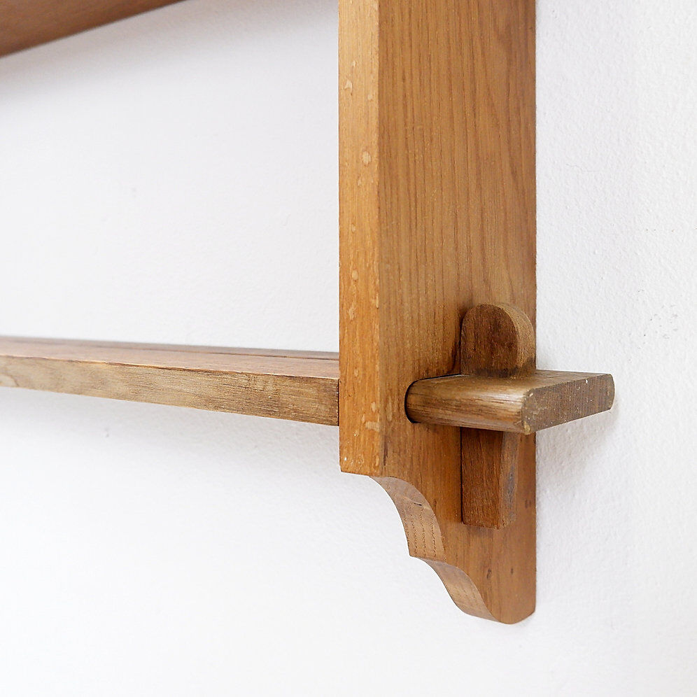 Wall shelves with dowels in Arts & Crafts style