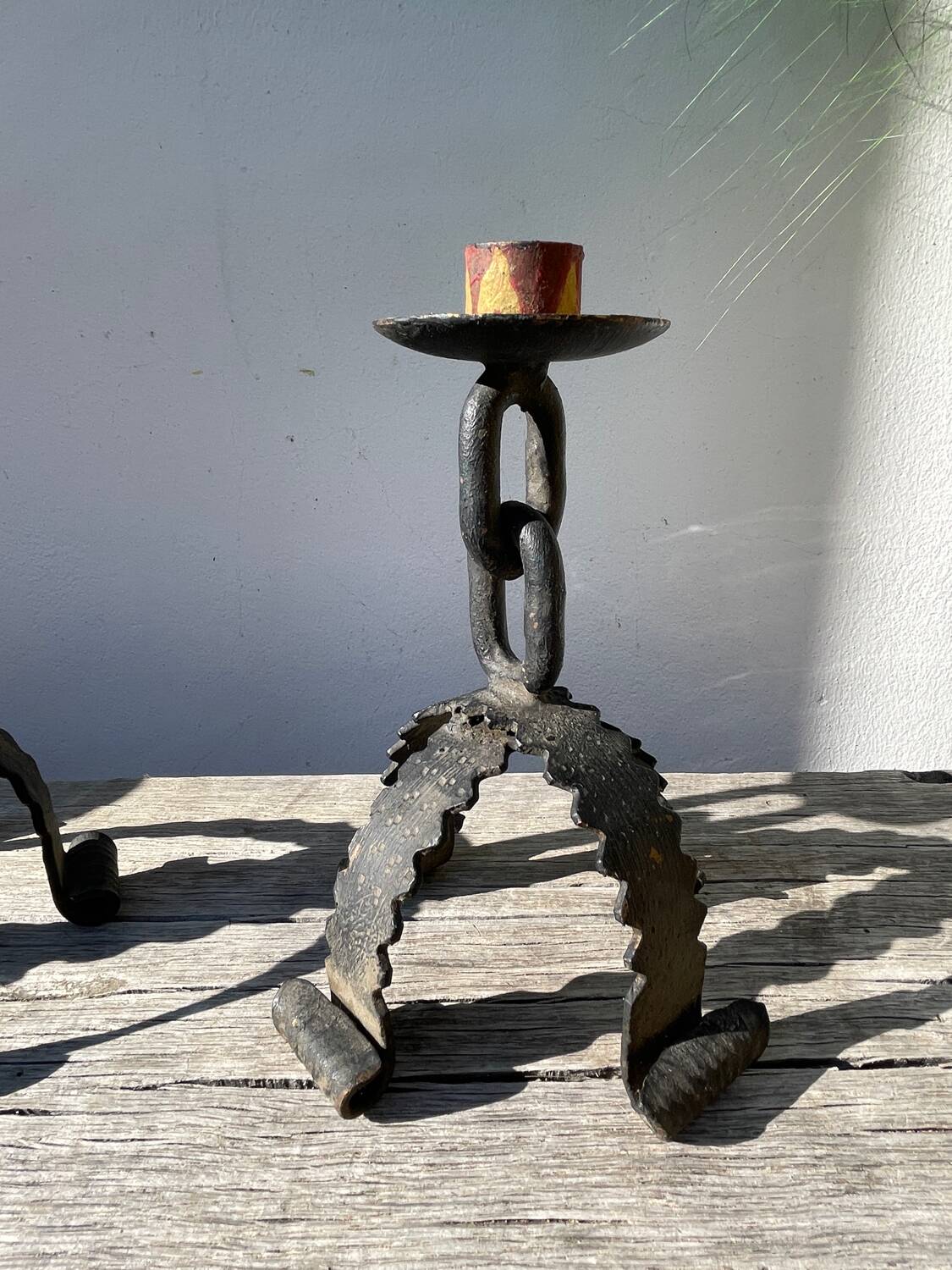 Pair of candlesticks with wrought iron chain