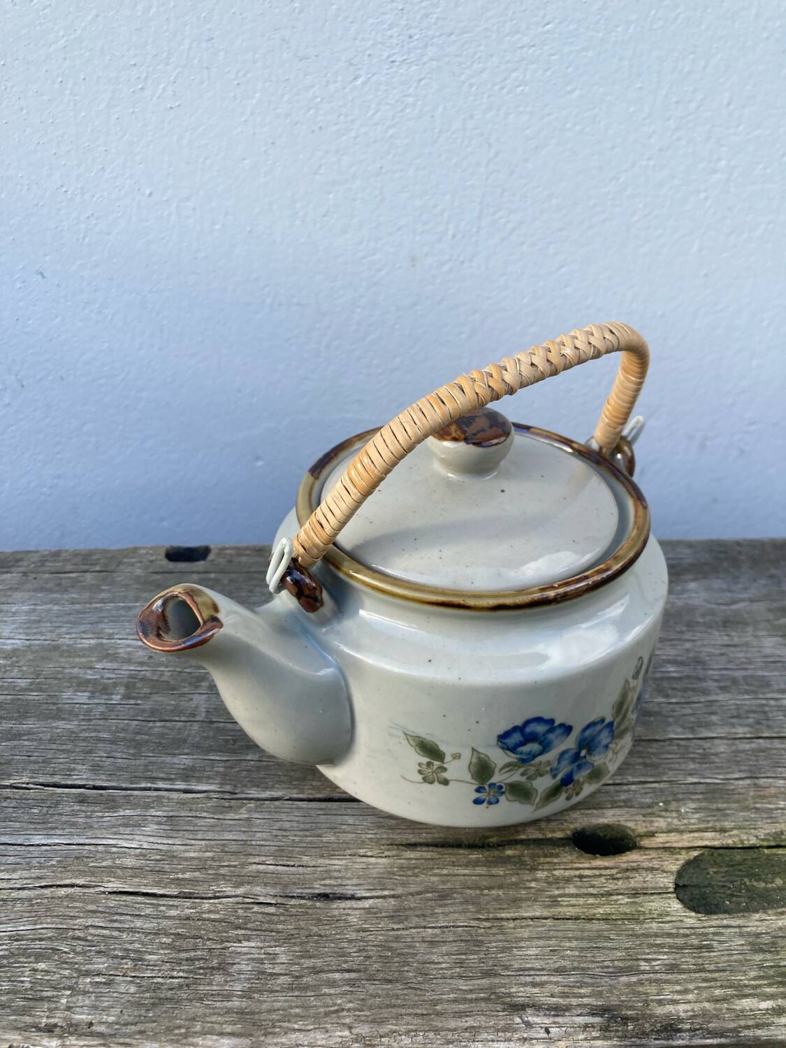 Chinese ceramic and rattan teapot