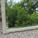 Large antique bevelled mirror in carved solid wood, green lizard – 129 × 75