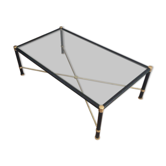 Brass coffee table upholstered in black leather. In the style of Jacques Adnet.