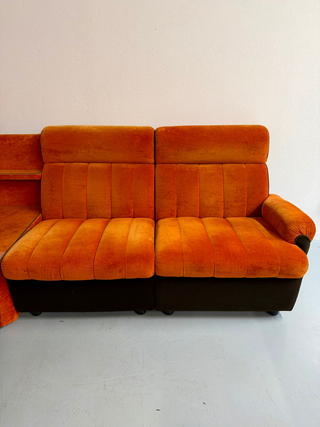 Modular vintage orange corner sofa, 1970s pop design.
