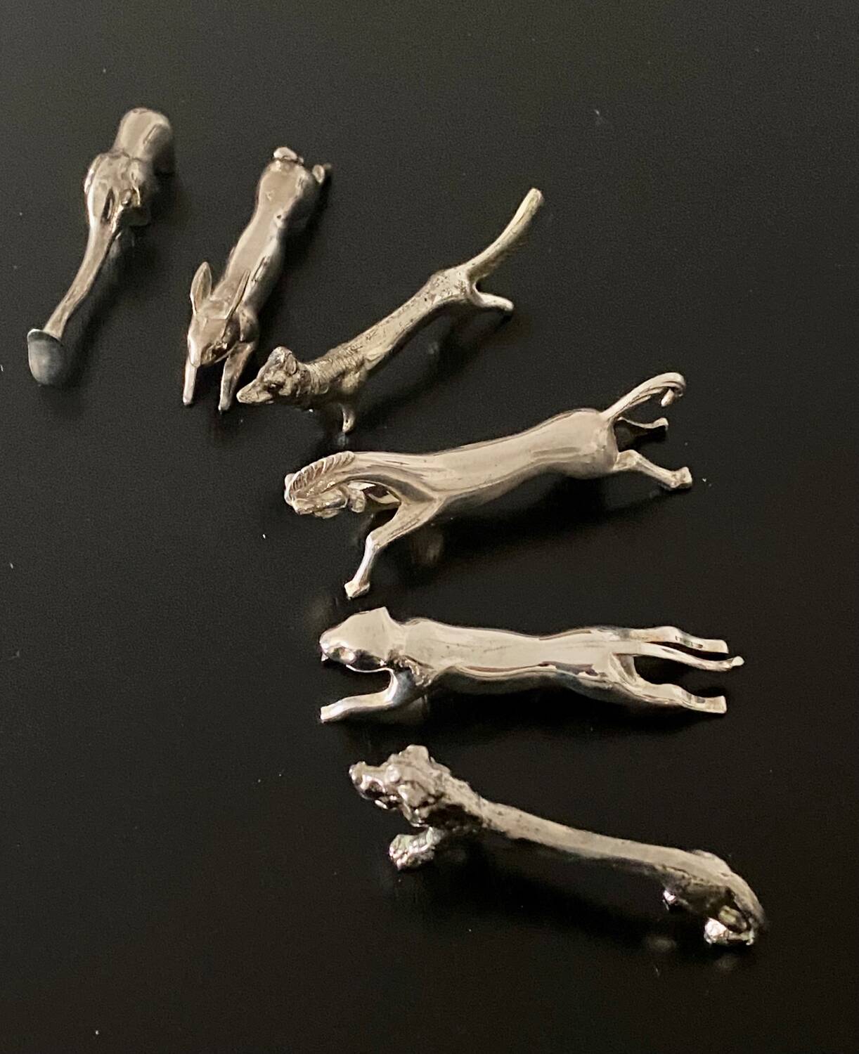6 various animal shaped knife holders in silver metal