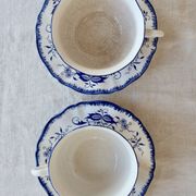 Old Lancaster cups and saucers in white earthenware with blue decoration.