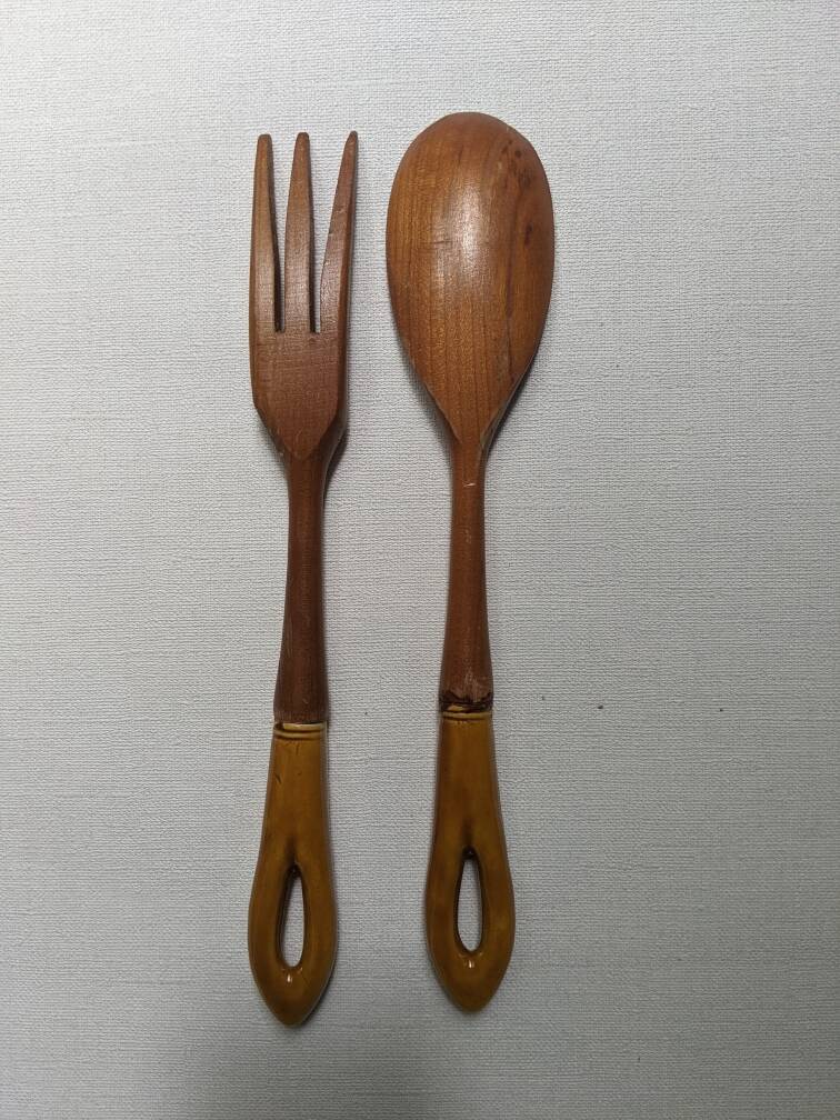 Antique wooden salad servers with earthenware handles, handcrafted