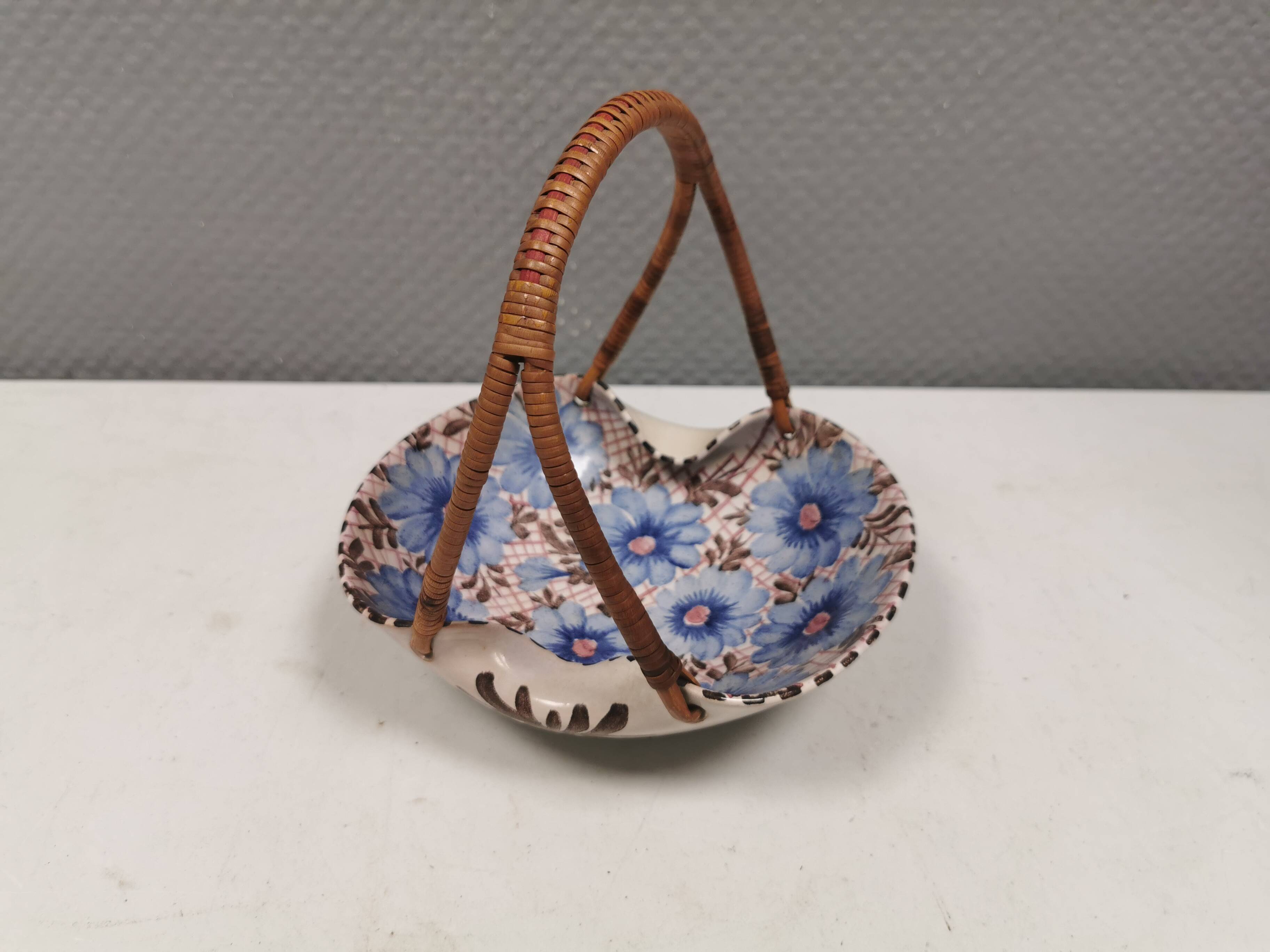 Beautiful small painted ceramic basket with woven handle
