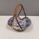 Beautiful small painted ceramic basket with woven handle