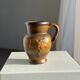Speckled stoneware jug with grape pattern H17