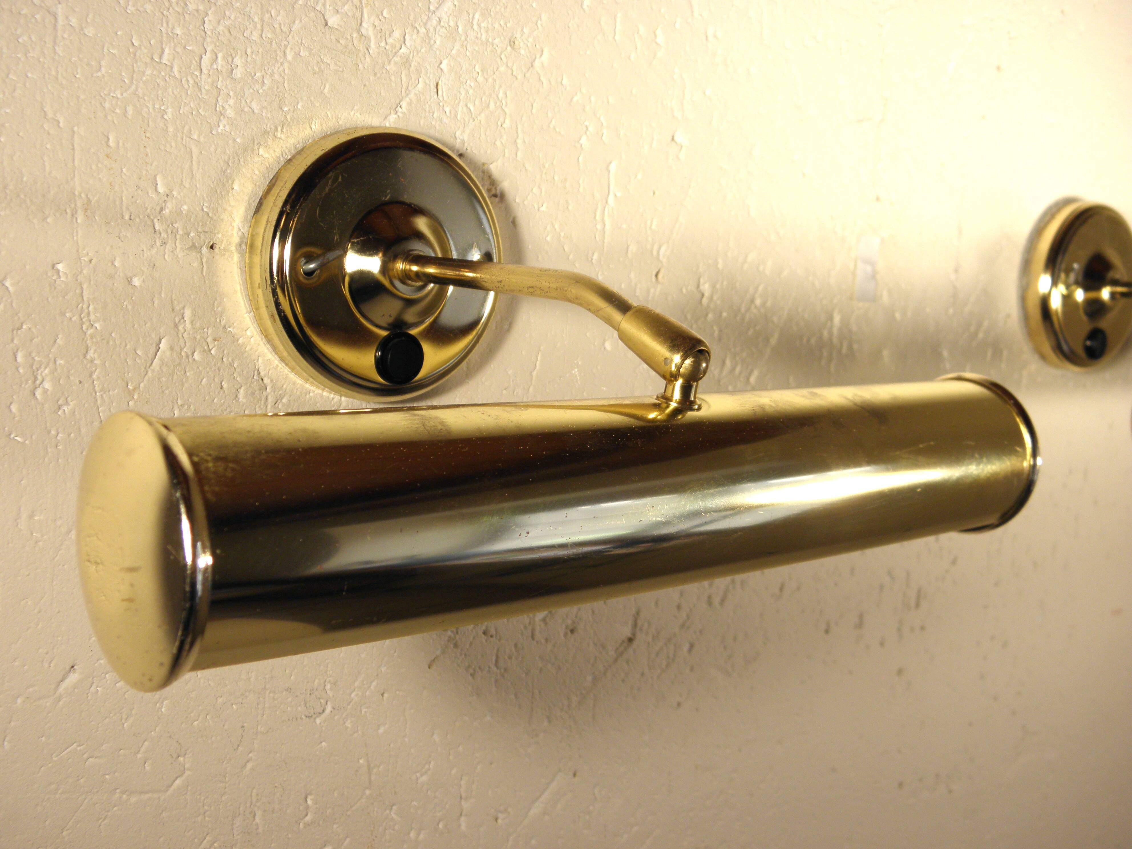 Two gold metal picture sconces