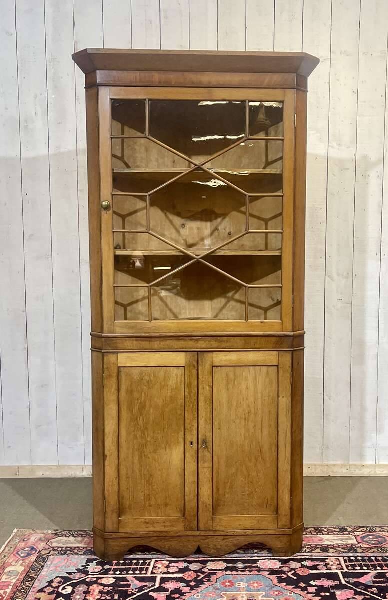 19th-century English corner cabinet in oak, mahogany, and fir.