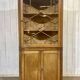 19th-century English corner cabinet in oak, mahogany, and fir.