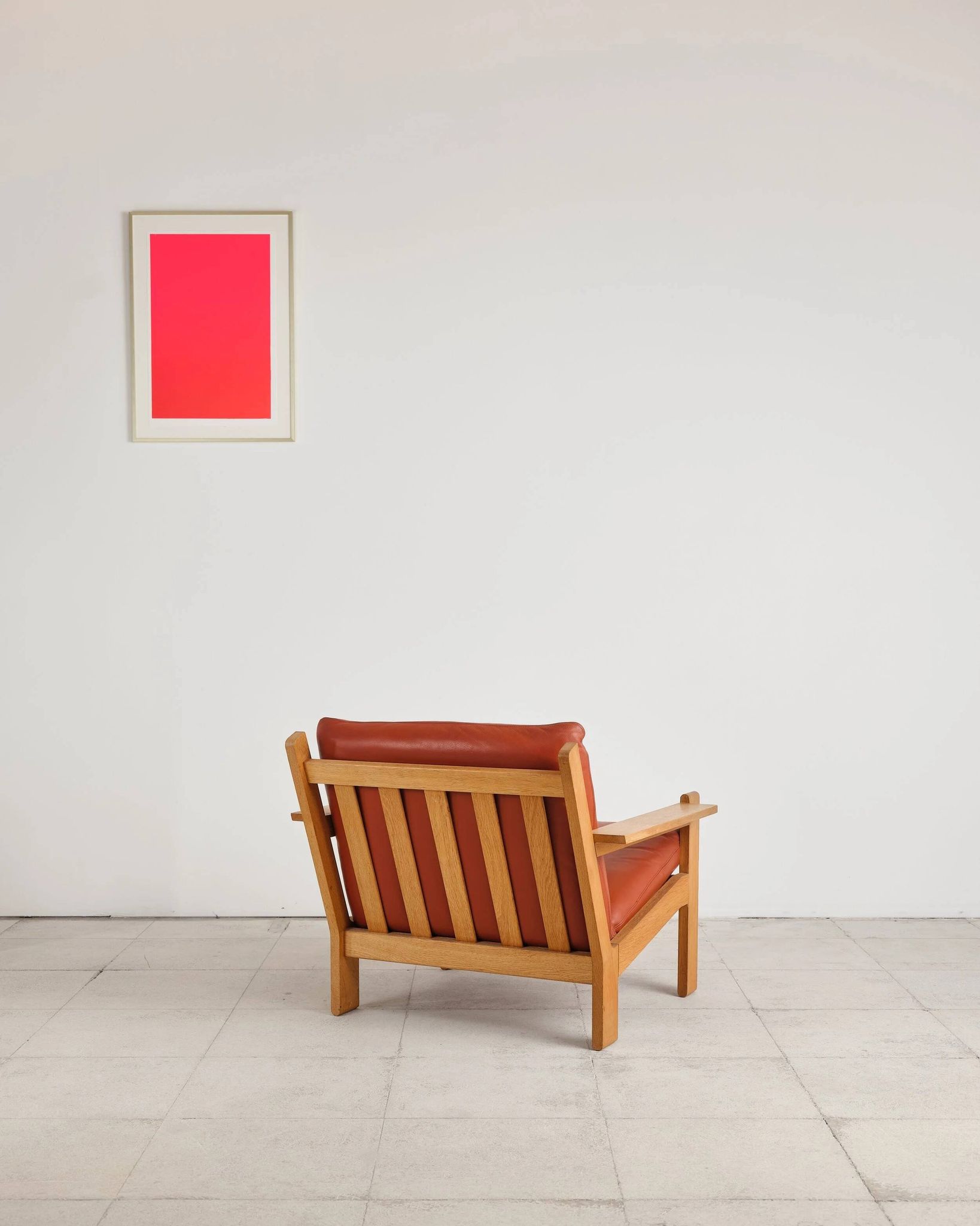 Brutalist armchair in oak and leather by Tage Poulsen, Denmark, 1970s.
