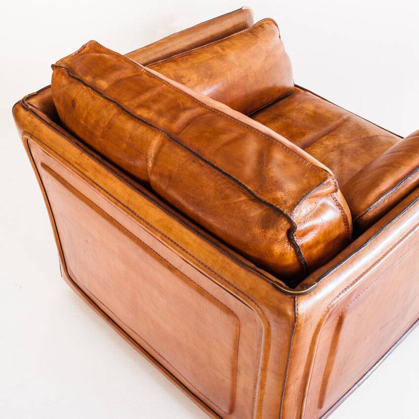 Vintage club armchair by Roche Bobois. Camel buffalo leather. France, 1980s.