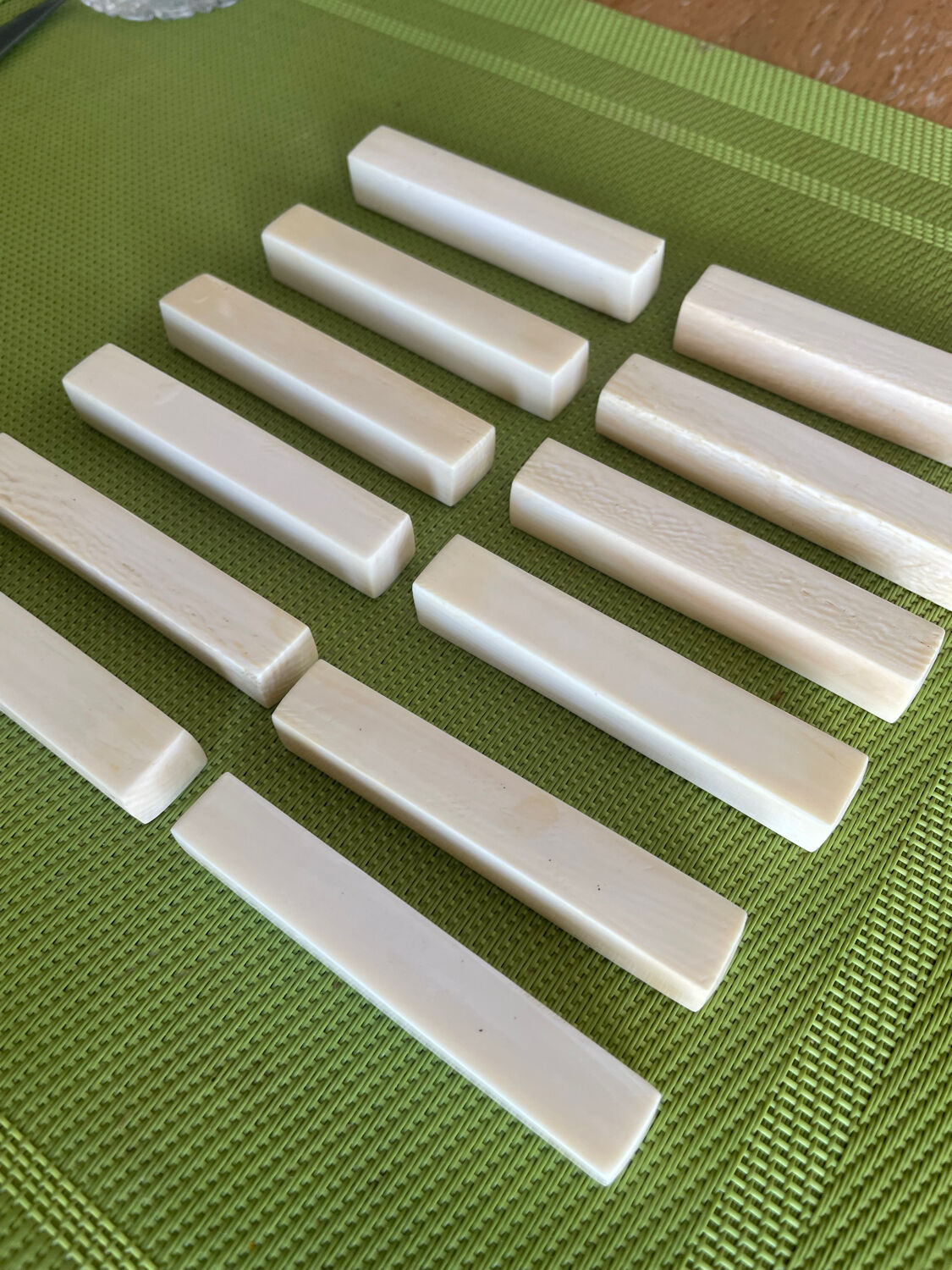 Set of 12 vintage knife rests in polished bone - ivory look, minimal