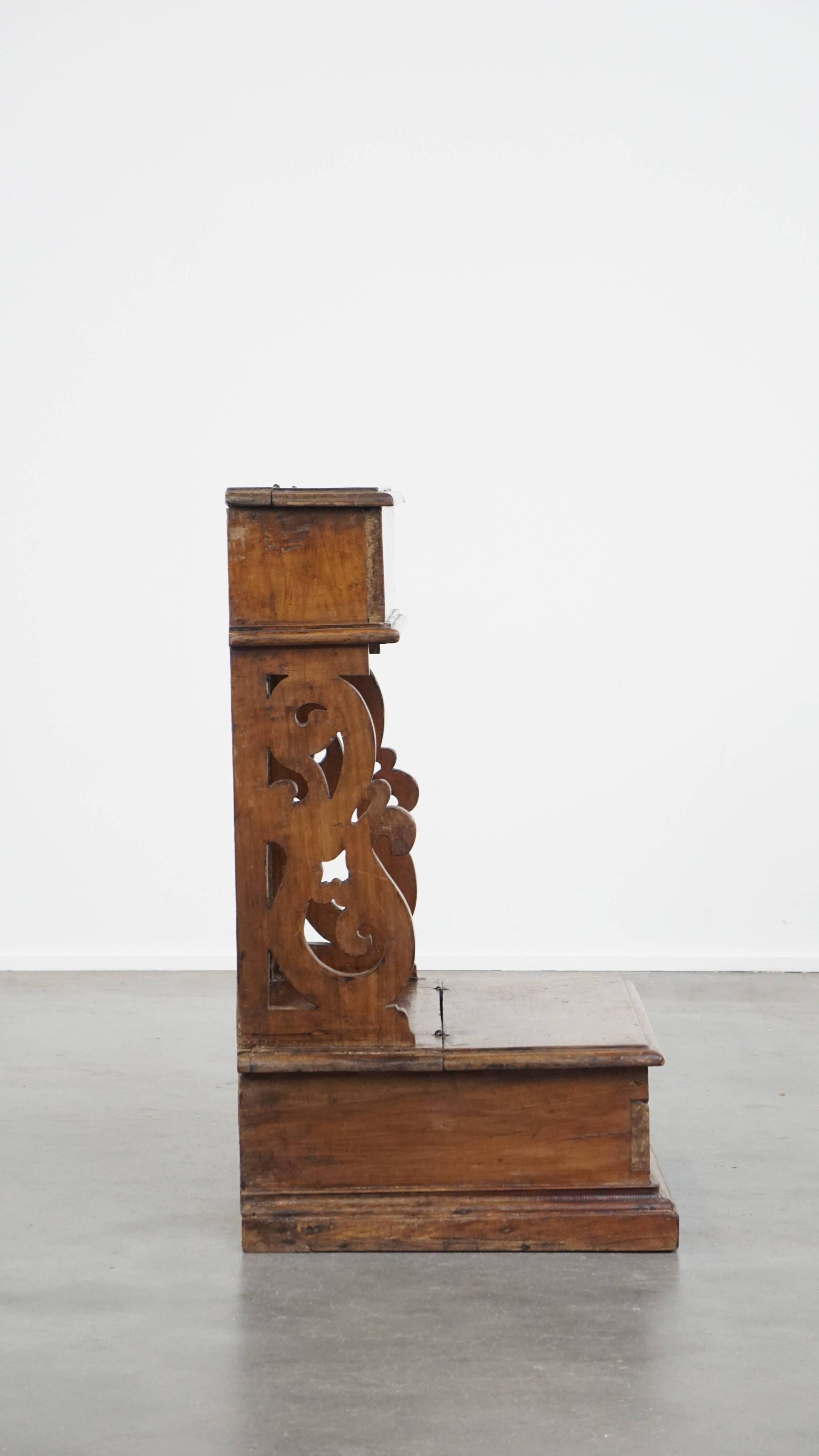 Antique pinewood church pew with storage compartments from the 18th century