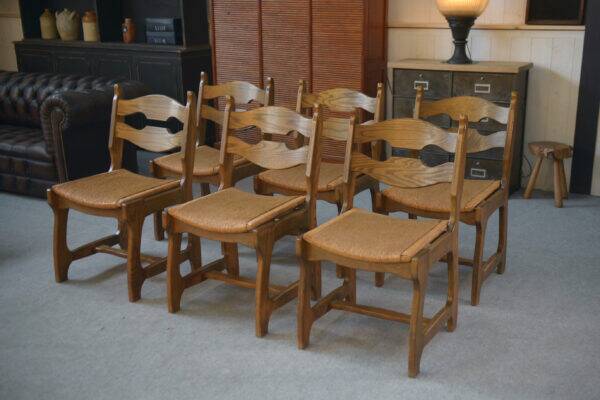 Set of 6 oak dining chairs with rush seat and 'Echelle' backrest in the style of Guillerme et Chambron 1950s