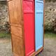 Vintage oak compass foot cabinet with 2 sliding doors painted red and blue