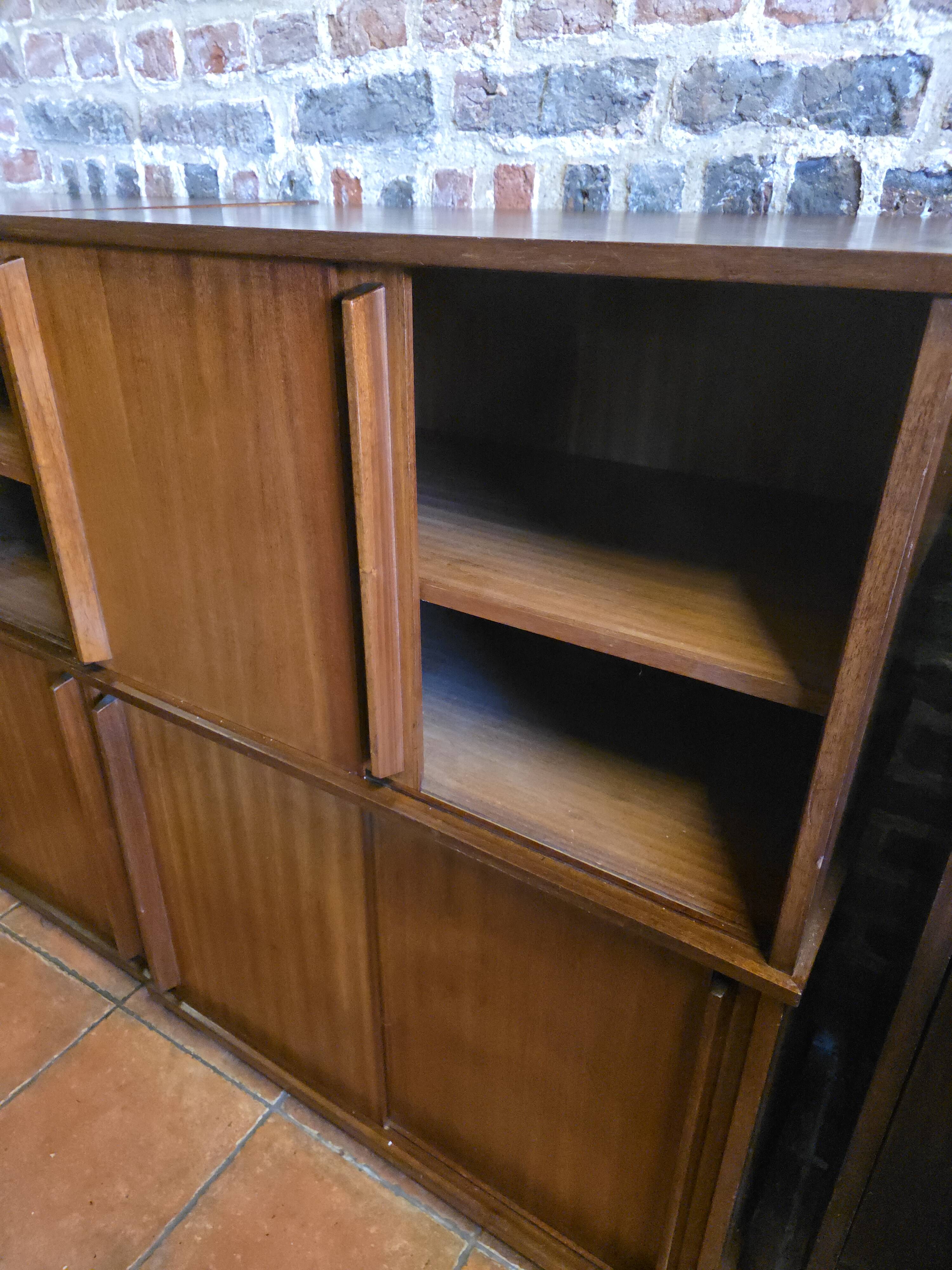 Modular corner library Oscar from the 1960s with sliding doors.
