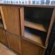 Modular corner library Oscar from the 1960s with sliding doors.