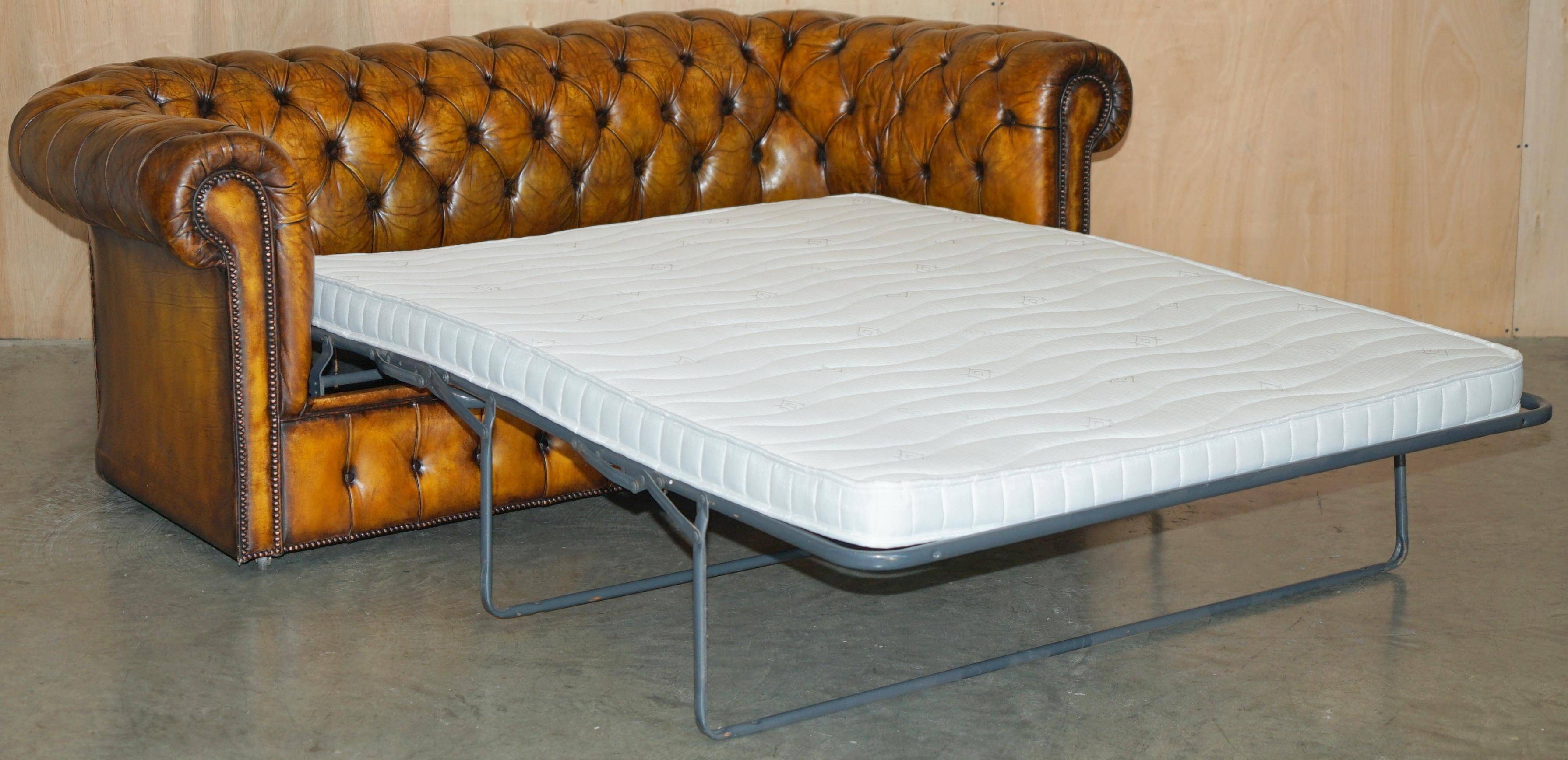 Vintage Chesterfield leather sofa bed, fully restored, circa 1940.