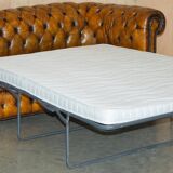 Vintage Chesterfield leather sofa bed, fully restored, circa 1940.