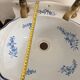 Wall-mounted washbasin shell-shaped, enamelled earthenware by Maurice Herb.