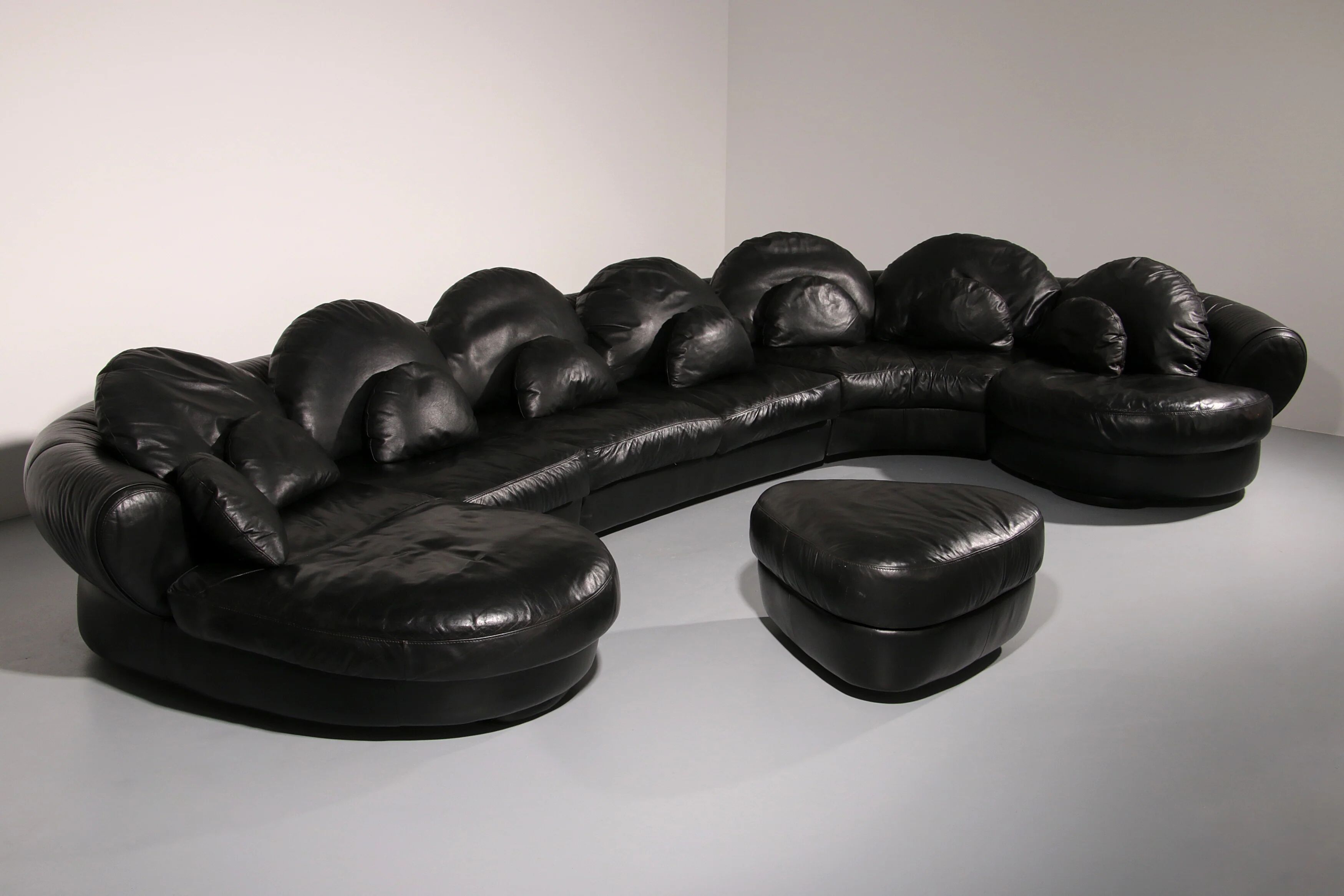 Organically shaped post-modern sectional sofa in black leather