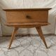 Scandinavian style bedside table with tapered legs from the 1960s.