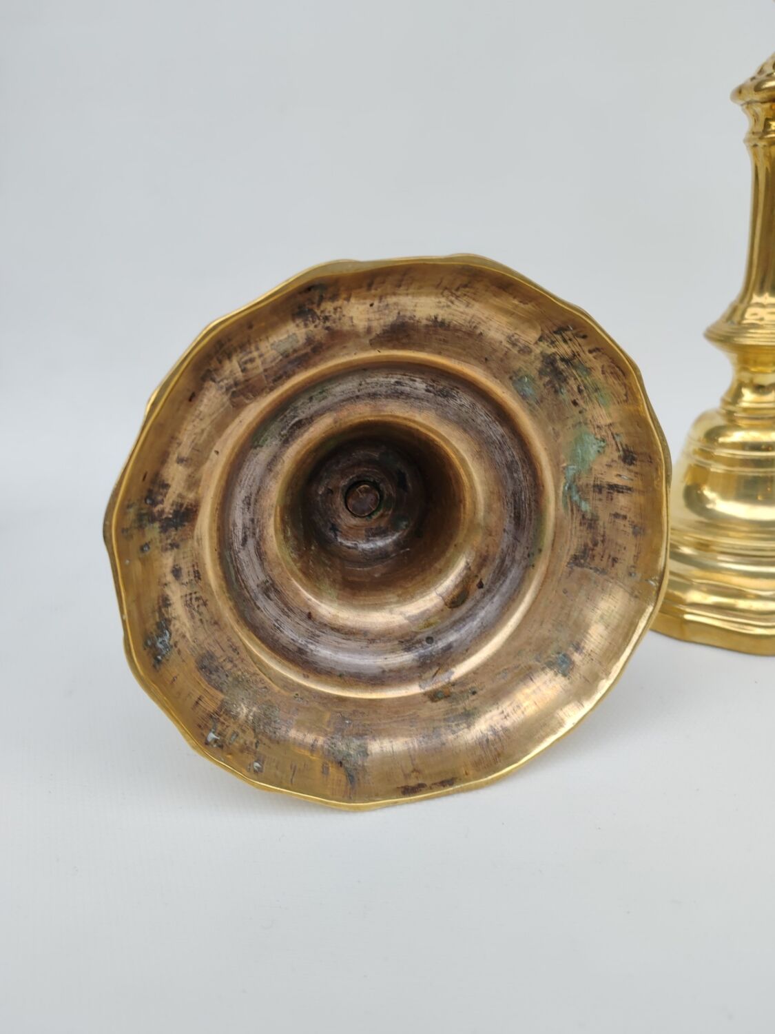 Pair of solid brass candlesticks, early 18th century.