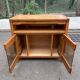 Glass-fronted Scandinavian oak sideboard from the 1980s.