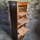 French antique wardrobe with curtain in oak, circa 1920–1930.
