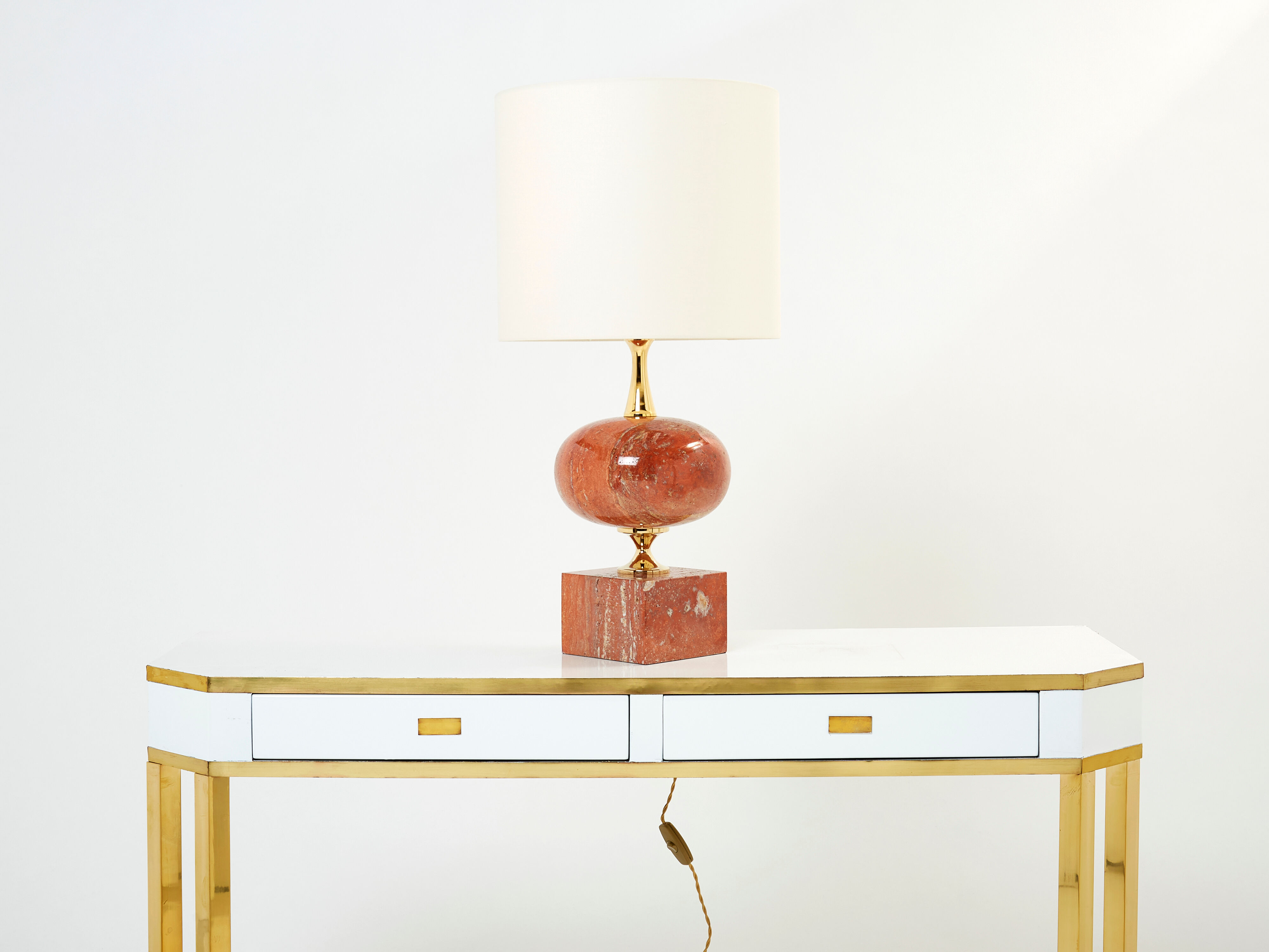 Pair of lamps in red travertine and brass 1970