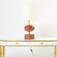Pair of lamps in red travertine and brass 1970