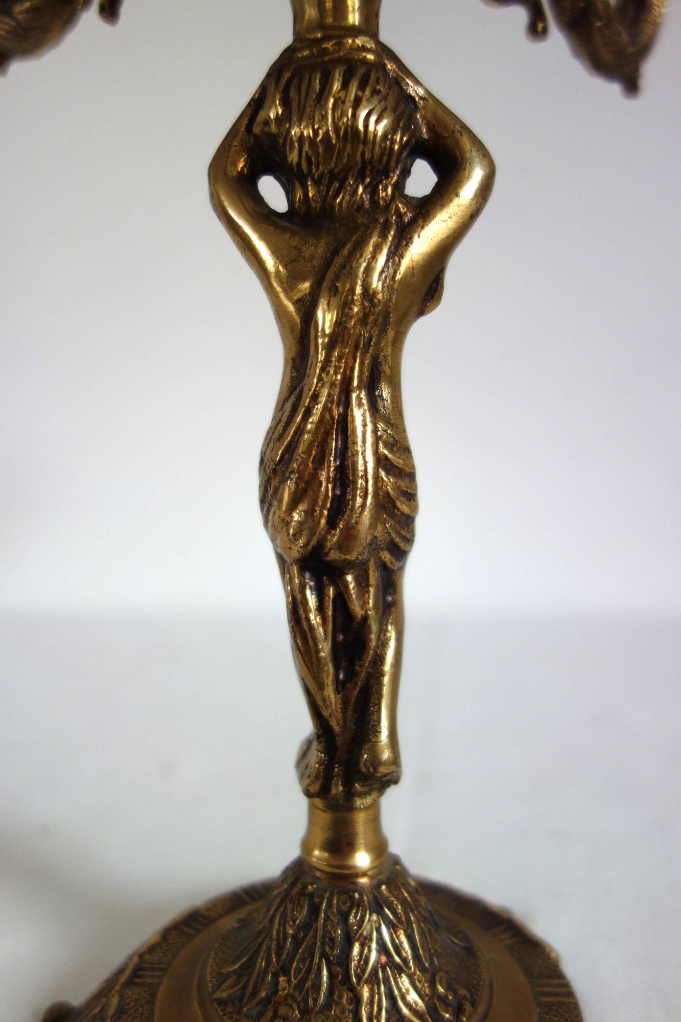 Pair of cherub candle holders in gilded bronze, early 20th century.