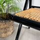 Vintage folding chairs in black wood and cane.