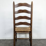 Series of 10 chairs in the style of Charlotte Perriand.