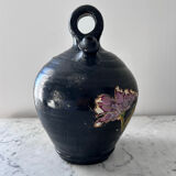 Black water jug with floral decoration