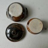 6 cups, 1 sugar bowl and 1 milk pot, made of sandstone by Isabelle Roger and Pierre Bernier