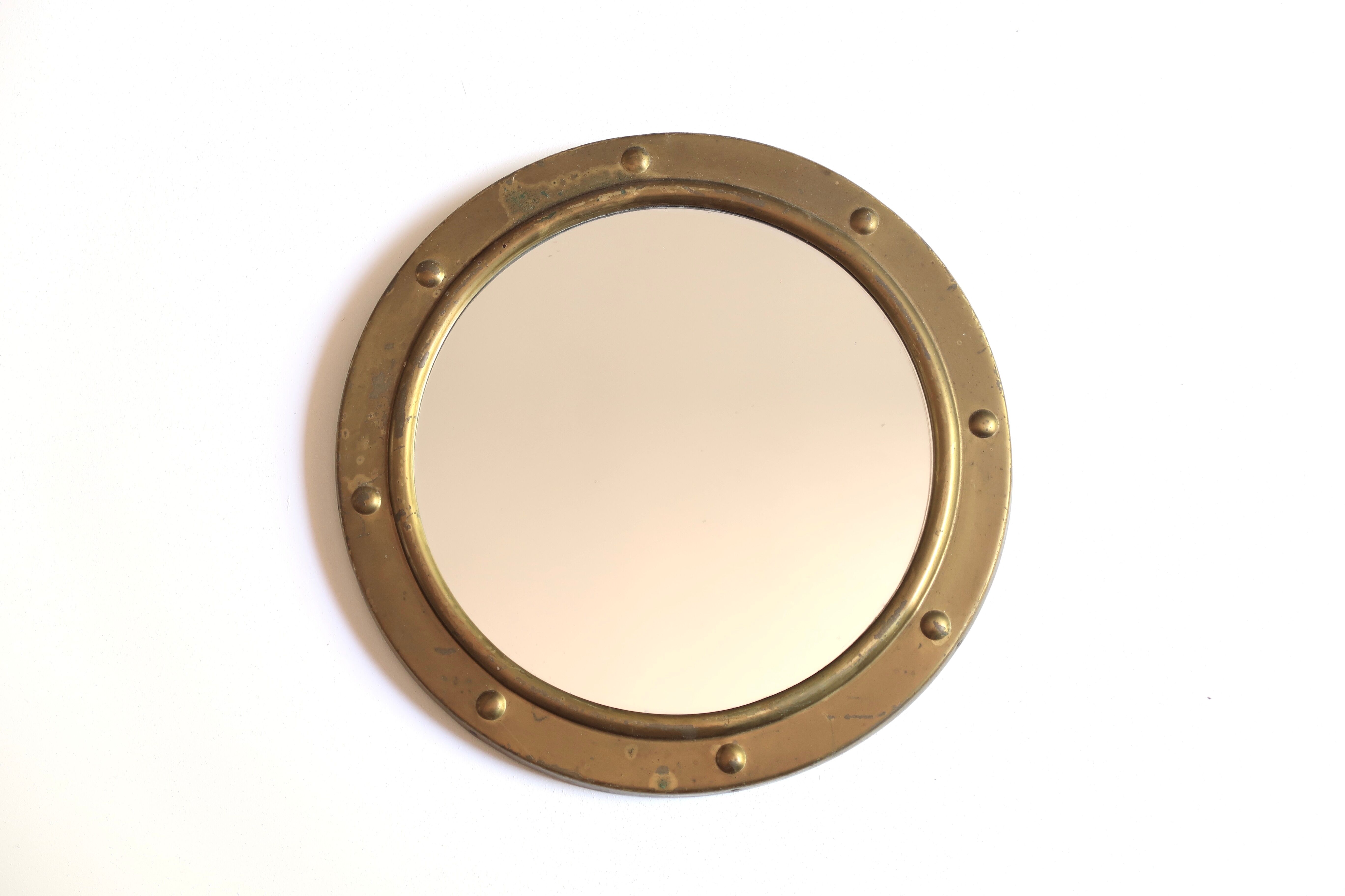 Round brass porthole mirror, 60s