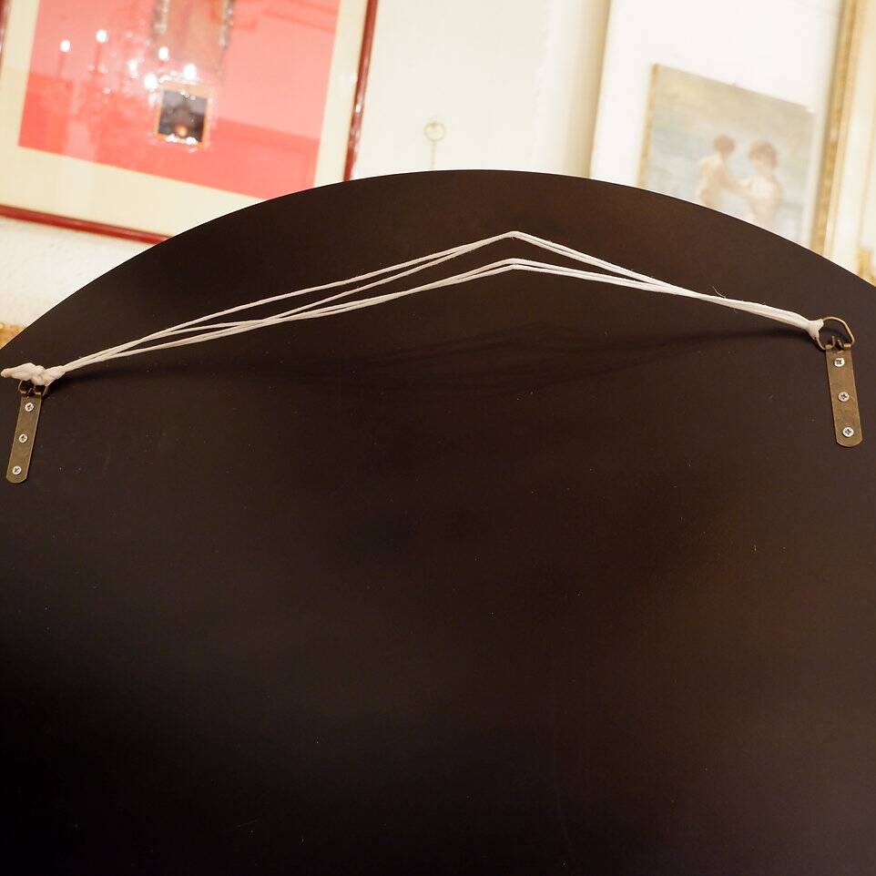 Pair of black and gold glass mirrors