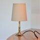 Bedside lamp in gold metal and linen lampshade