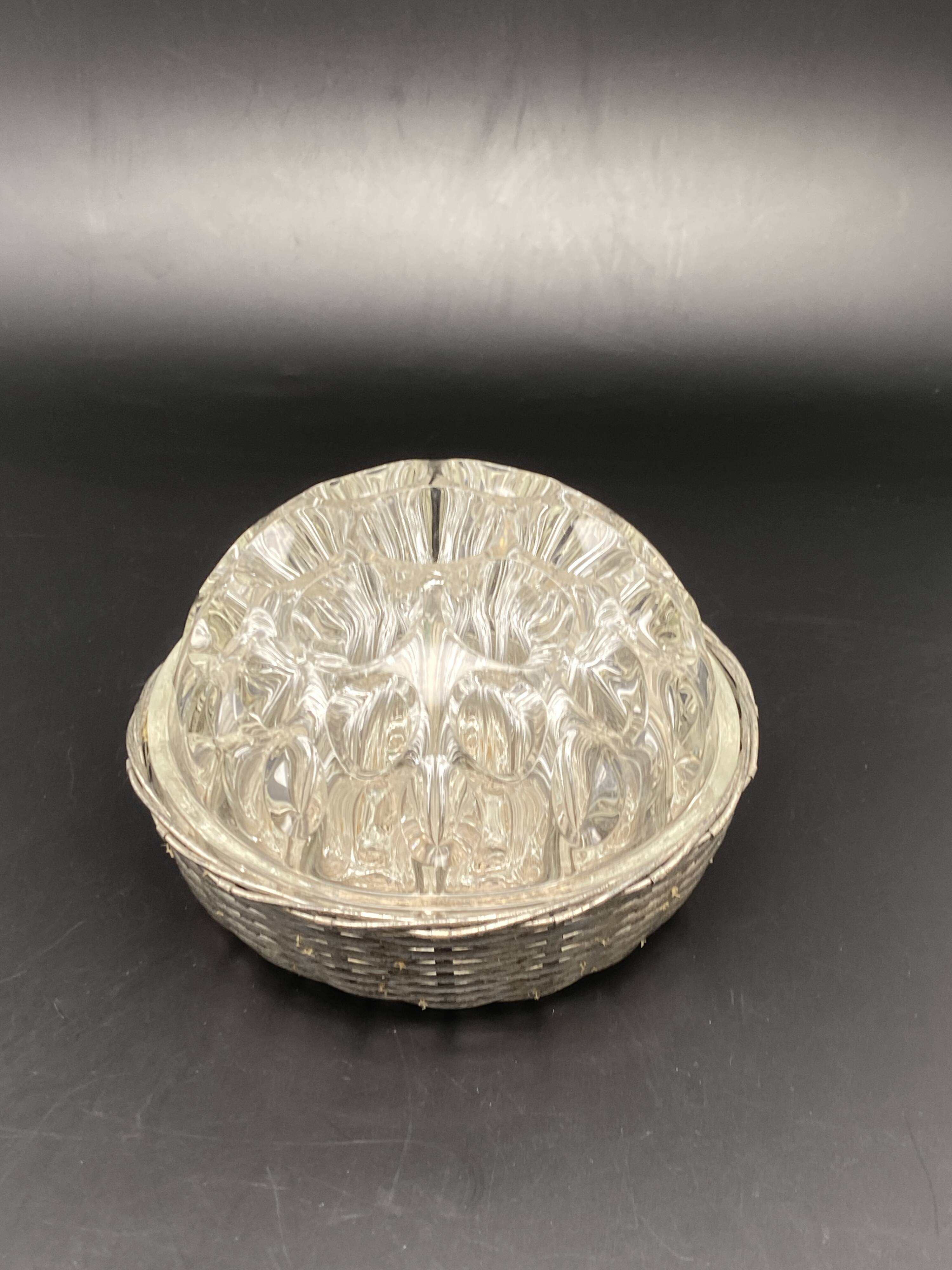 Glass flower stand with woven metal support