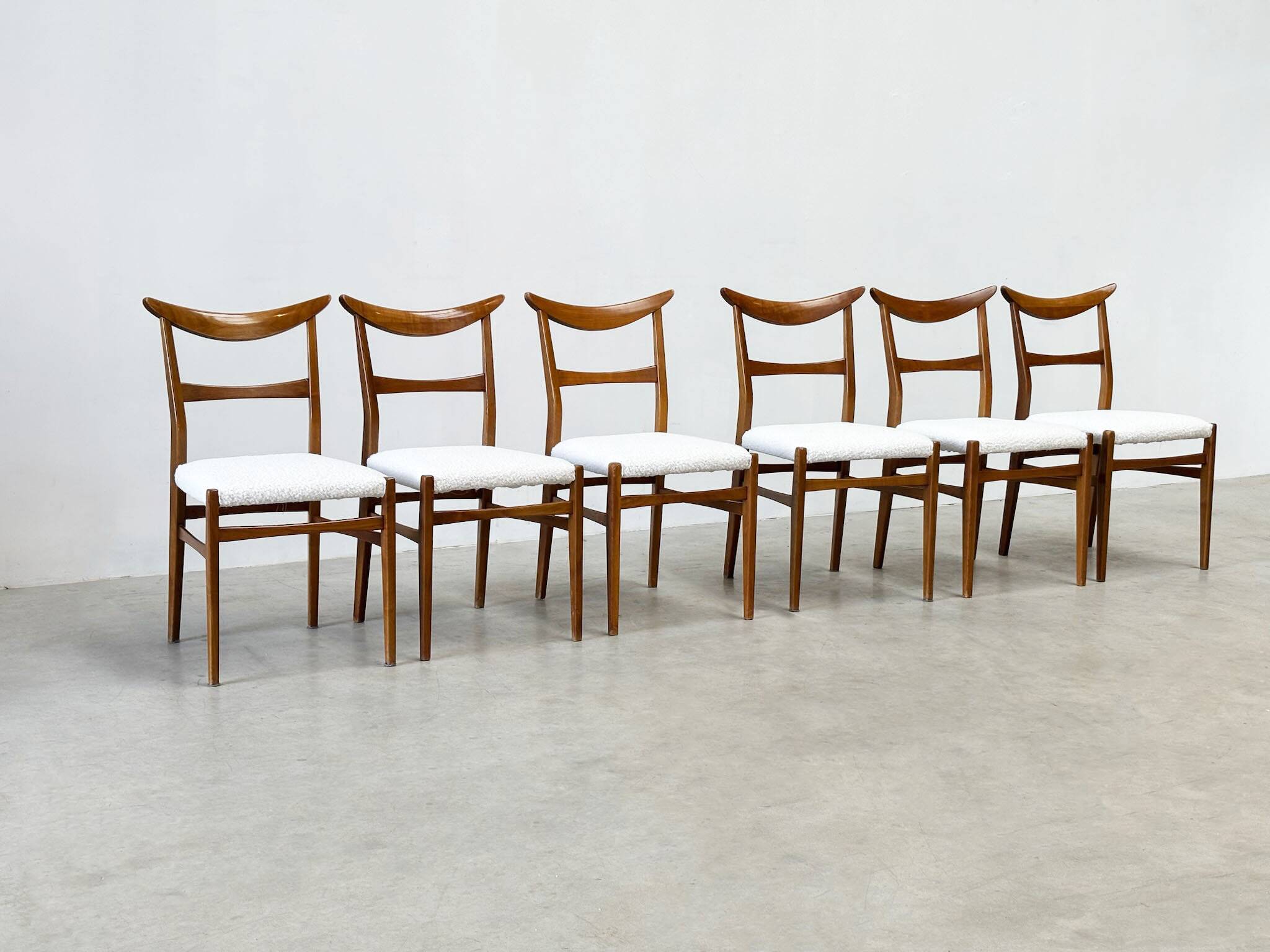 Set of six walnut Lübke dining chairs