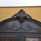 Bookcase black patina shell pediment 2 drawer doors
