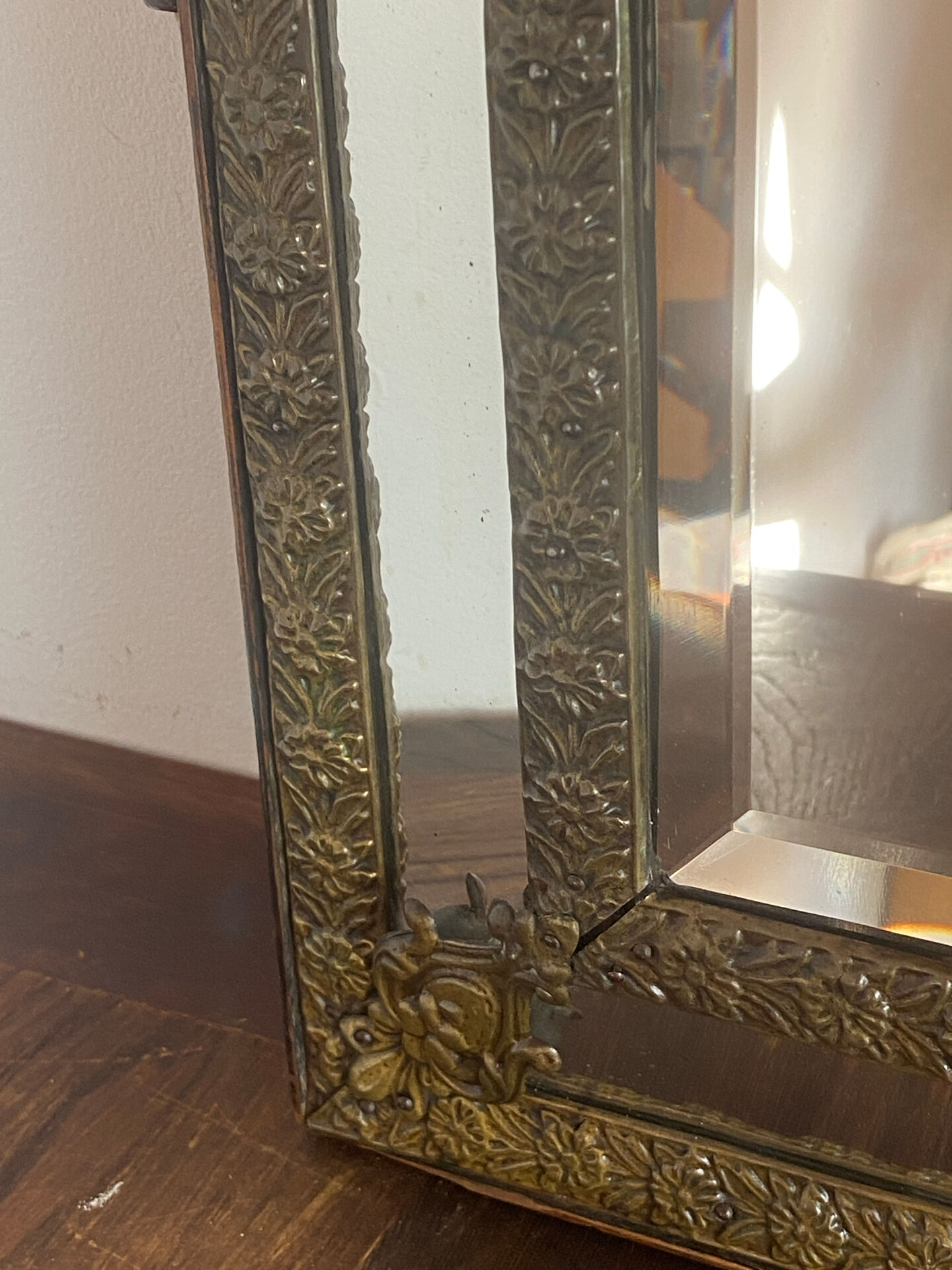 Mirror with brass repoussé frame