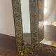 Mirror with brass repoussé frame