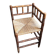 Corner chair in turned wood and straw