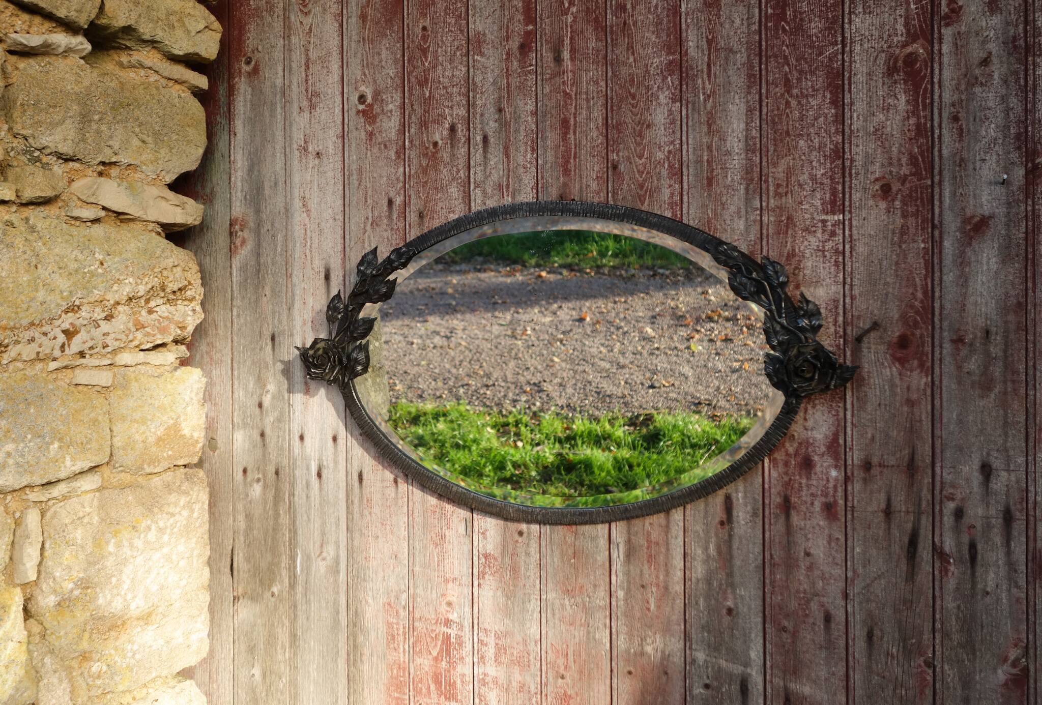 Art Deco mirror in wrought iron and beveled glass